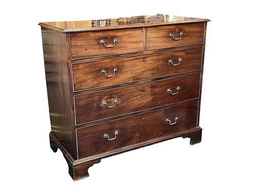 Lot 546 - A George III mahogany chest of drawers, two...