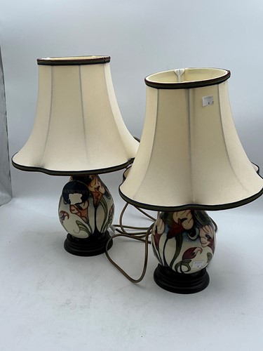 Lot 100 - A pair of Moorcroft Au Reviour lamps by Sian...