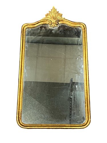 Lot 590 - A gilt framed wall mirror, modern, the arched...