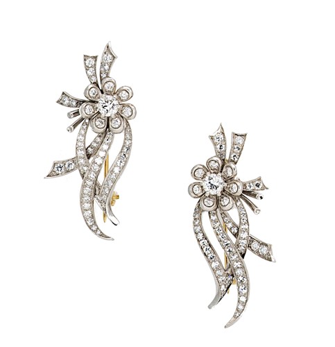 Lot 188 - A pair of diamond set floral brooches