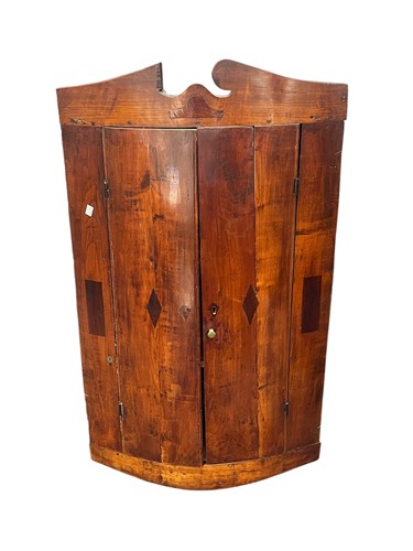 Lot 628 - A 19th century fruitwood corner cupboard with...