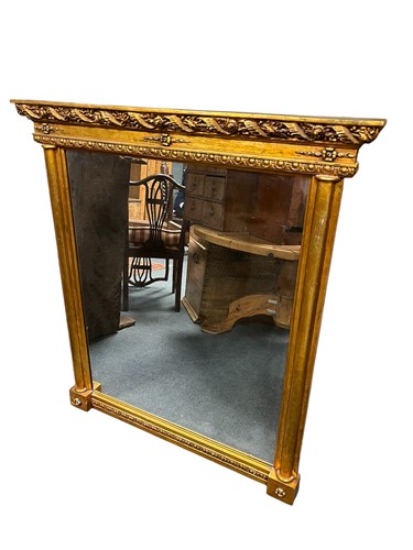 Lot 678 - A modern gilded overmantel mirror with floral...