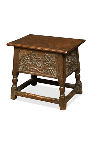 Lot 392 - A carved oak joint stool converted to a coal box, early 20th century