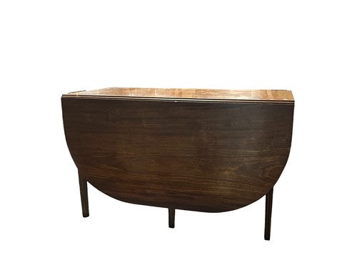 Lot 687 - A Georgian mahogany drop leaf table on tapered...