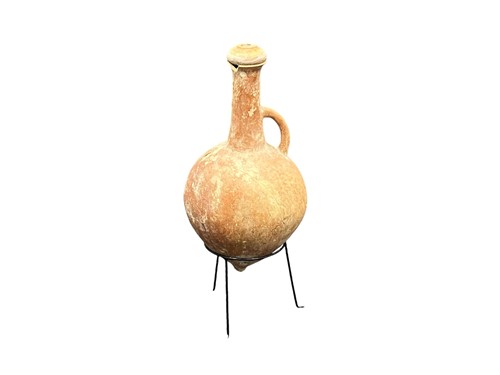 Lot 771 - An archaeological earthenware amphora on stand...