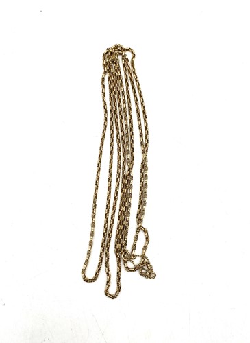 Lot 184 - A long guard chain, stamped '9CT', weight 22.1g