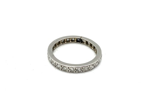 Lot 185 - A diamond set full eternity ring, tested as...