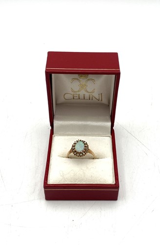 Lot 190 - An opal and split pearl ring, size L, tested...