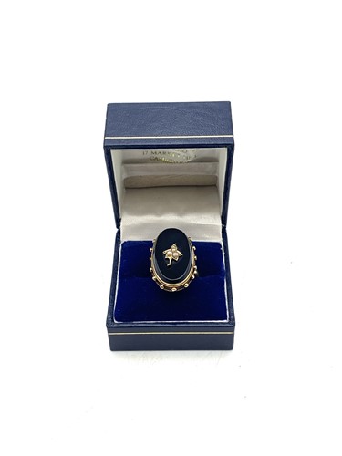 Lot 192 - A black enamel and split pearl ring, Victorian...