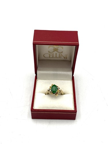 Lot 189 - An imitation jade and diamond set ring, tested...
