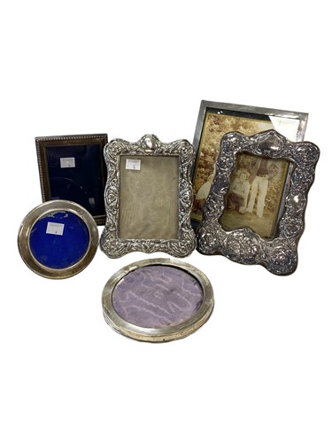 Lot 153 - A collection of five silver photograph frames,...