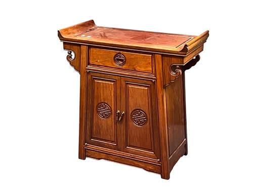 Lot 718 - A modern Chinese hardwood side cabinet, with...