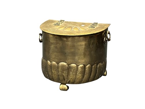 Lot 654 - A brass coal box, early 20th century, with bow...
