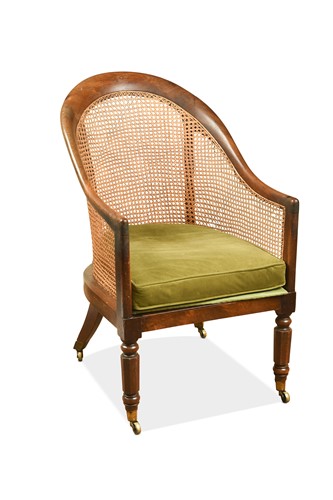 Lot 502 - A Regency mahogany bergère library armchair