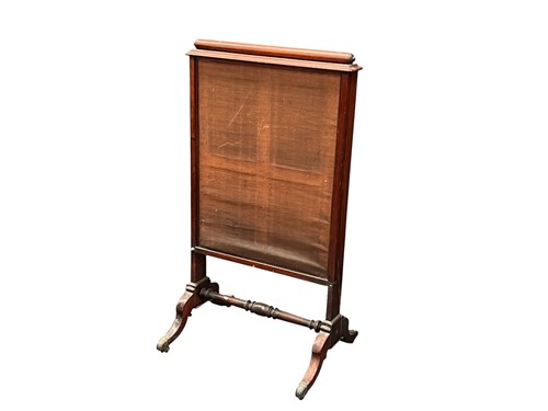 Lot 650 - A Regency mahogany fire screen, on four...