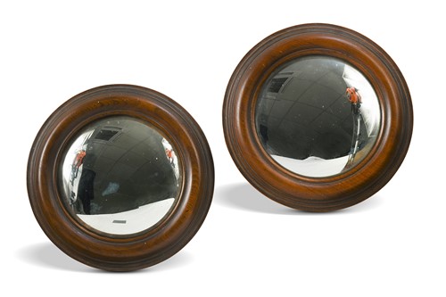 Lot 549 - A pair of small Regency convex mirrors