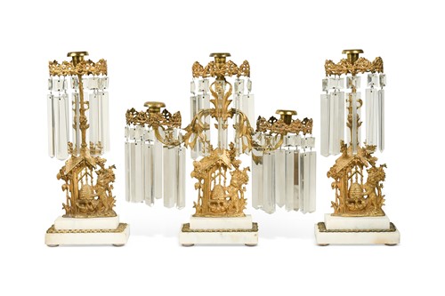 Lot 556 - A suite of three gilt-metal and marble candle lustres, late 19th century