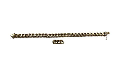 Lot 207 - A hallmarked 9ct gold curb bracelet with extra...