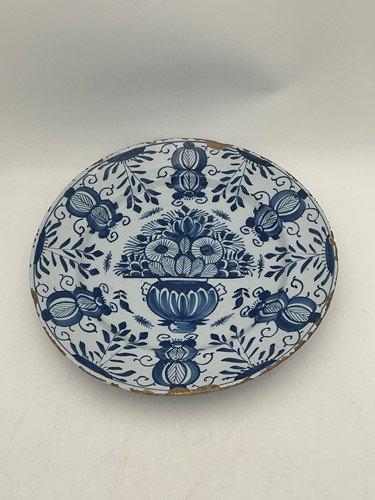 Lot 17 - A large 18th century Dutch Delft charger, with...