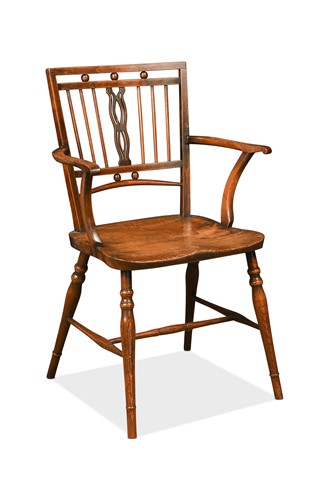 Lot 360 - A fruitwood and elm Mendlesham elbow chair, early 19th century