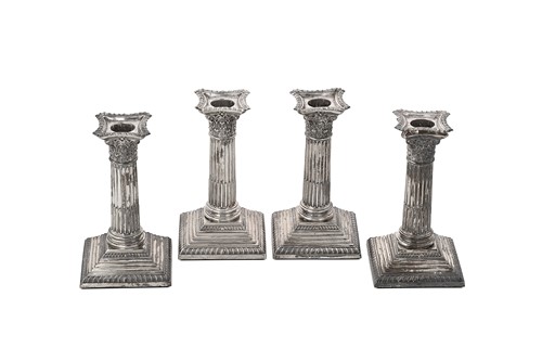 Lot 390 - Four Edward VII silver Corinthian column candlesticks