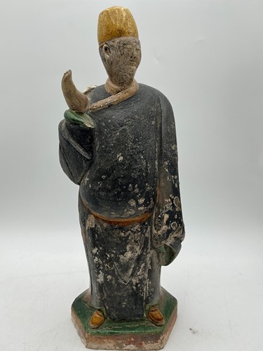 Lot 210 - A Tang style pottery figure of a robed man