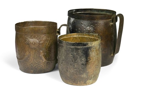 Lot 52 - A Chinese graduated set of three bronze jugs, perhaps Ming Dynasty