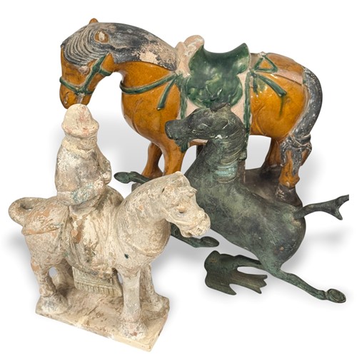 Lot 12 - A Chinese pottery equestrian group, probably Ming Dynasty