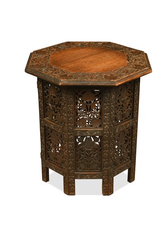 Lot 631 - An Anglo-Indian carved teak folding table, early 20th century
