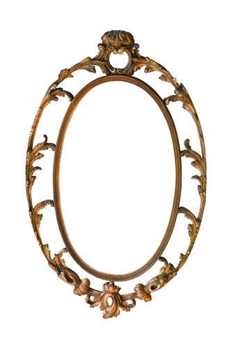 Lot 530 - A George III carved giltwood oval wall mirror