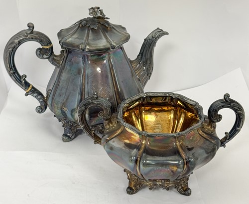 Lot 16 - A Victorian silver teapot and sugar basin en...