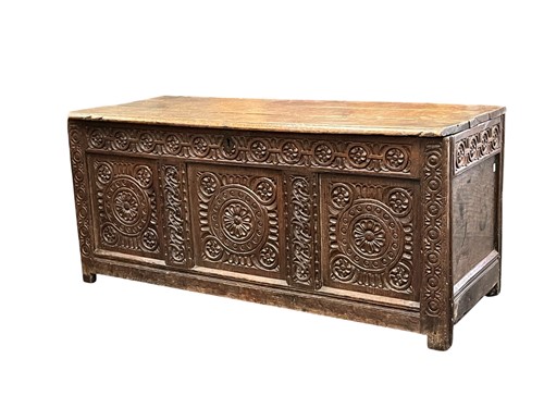 Lot 657 - A late 17th century carved oak coffer chest,...