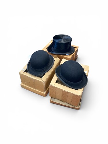 Lot 118 - A 'Mrs White, Jermyn Street' black top hat, a...