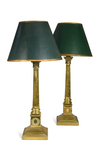 Lot 679 - A pair of brass column lamps, 20th century