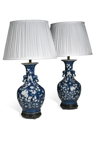 Lot 358 - A pair of Chinese blue ground and slip decorated vases, early 20th century