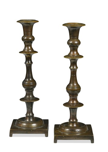 Lot 361 - A pair of patinated bronze candlesticks, 18th century