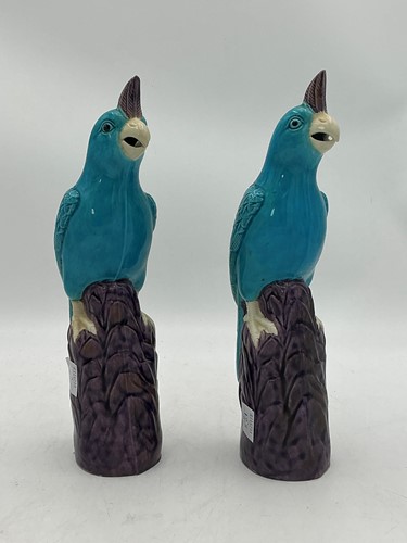 Lot 3 - A pair of ceramic parrots or parakeets in...
