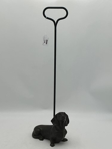 Lot 110 - A door stop in the form of an obedient...