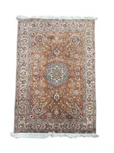 Lot 449 - A Tabriz carpet with salmon central ground and...