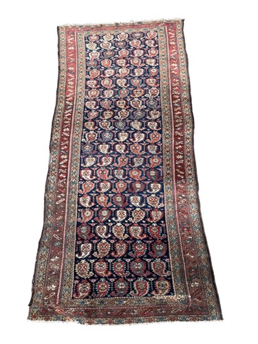 Lot 448 - A circa 1930s Persian runner with boteh on a...
