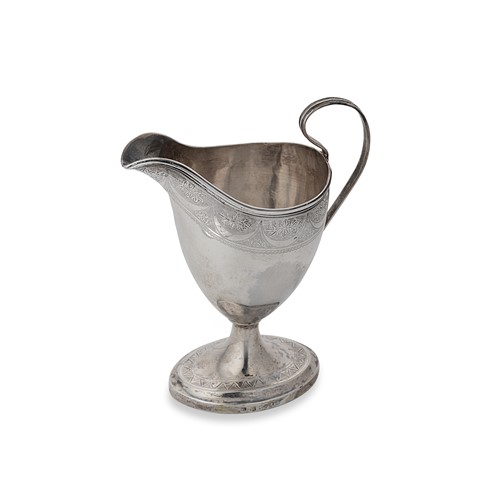 Lot 437 - A George III Scottish silver helmet shape cream jug