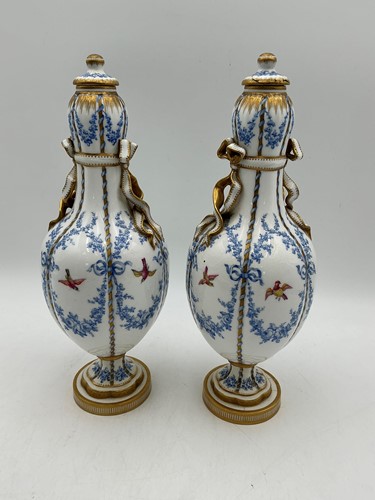 Lot 7 - A pair of continental porcelain vases and...
