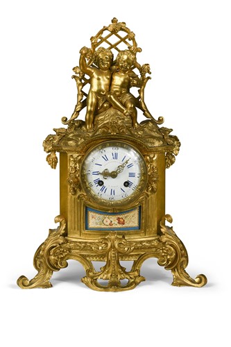 Lot 523 - A French Rococo style gilt metal and ormolu mounted mantel clock, 19th century