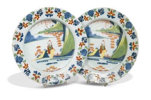 Lot 339 - A pair of Delft Lambeth polychrome chargers by Abigale Griffith, circa 1760.