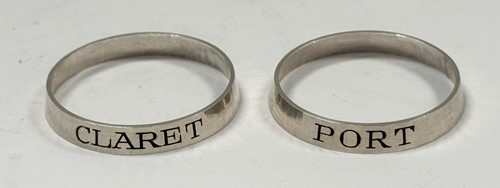 Lot 312 - Two Elizabeth II silver bottle labels, SJB,...