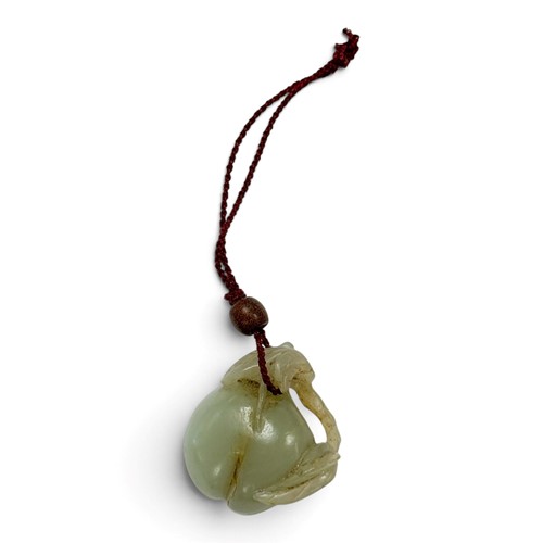 Lot 48 - A Chinese carved celadon jade peach pendant, Qing Dynasty, 18th or 19th century