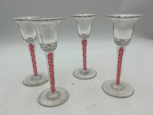 Lot 3 - A set of four coloured twist stem glasses,...
