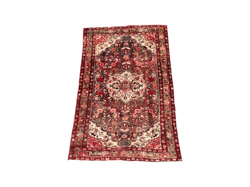 Lot 793 - A Hamadan rug central medallion on a red...