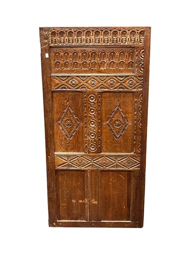 Lot 566 - A carved oak panel, 19th century, decorated...