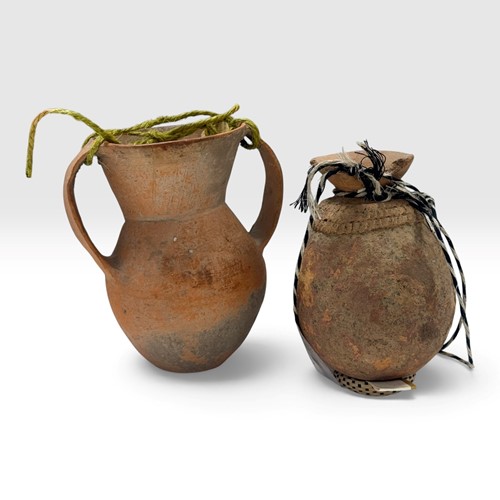Lot 3 - A Chinese terracotta two-handled vase, probably Neolithic, Qijia Culture